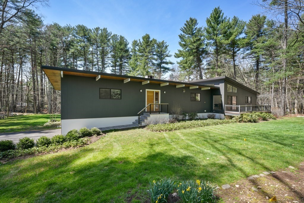 53 Beaver Road Weston, MA 02493 - Photo 3 of 38 a front view of a house with a garden