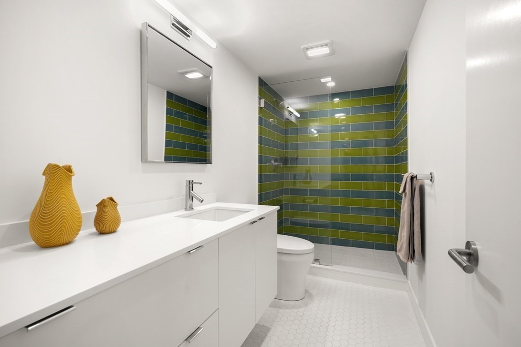 53 Beaver Road Weston, MA 02493 - Photo 32 of 38 a bathroom with a sink a toilet and shower