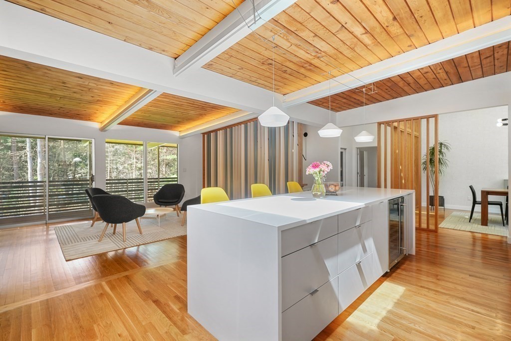 53 Beaver Road Weston, MA 02493 - Photo 7 of 38 a living room with stainless steel appliances kitchen island granite countertop a sink and a counter top space
