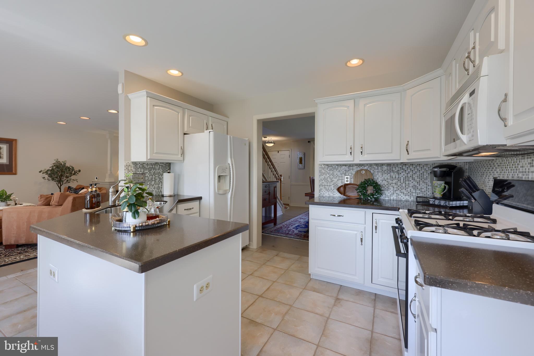 362 Squire Lane Lititz, PA 17543 - Photo 12 of 49 a kitchen with stainless steel appliances granite countertop a sink stove and refrigerator