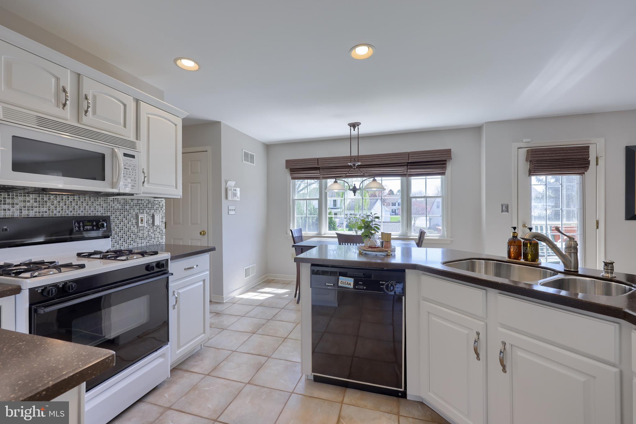 362 Squire Lane Lititz, PA 17543 - Photo 14 of 49 a kitchen with a sink stove and microwave