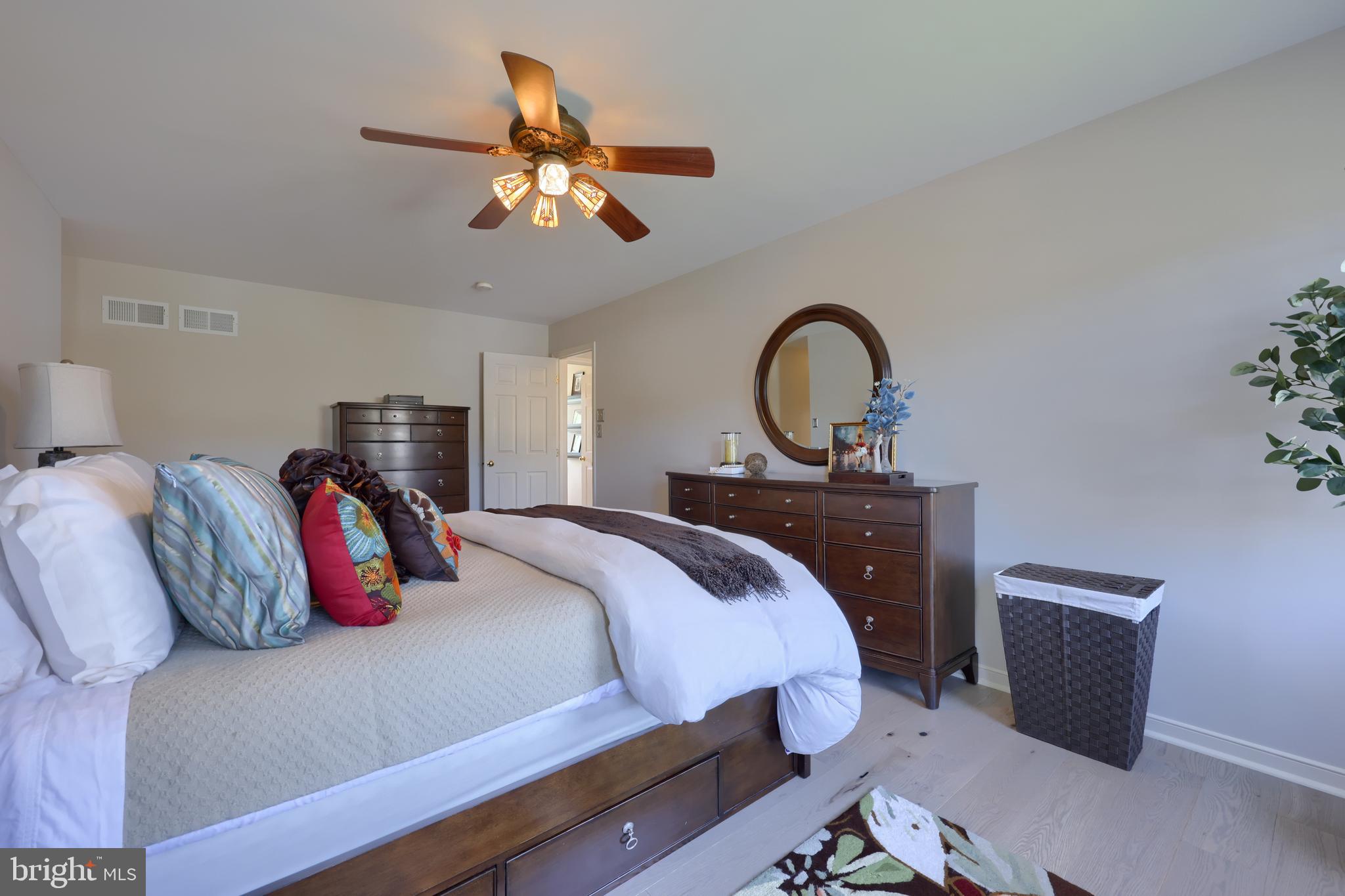 362 Squire Lane Lititz, PA 17543 - Photo 22 of 49 a bedroom with a bed and a potted plant on the dresser
