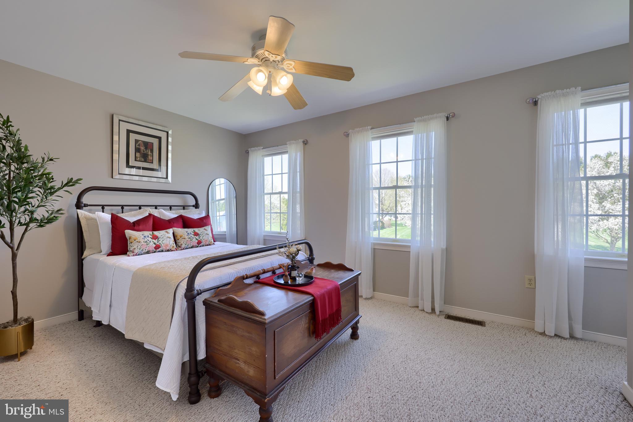 362 Squire Lane Lititz, PA 17543 - Photo 29 of 49 a bedroom with a bed and a chandelier