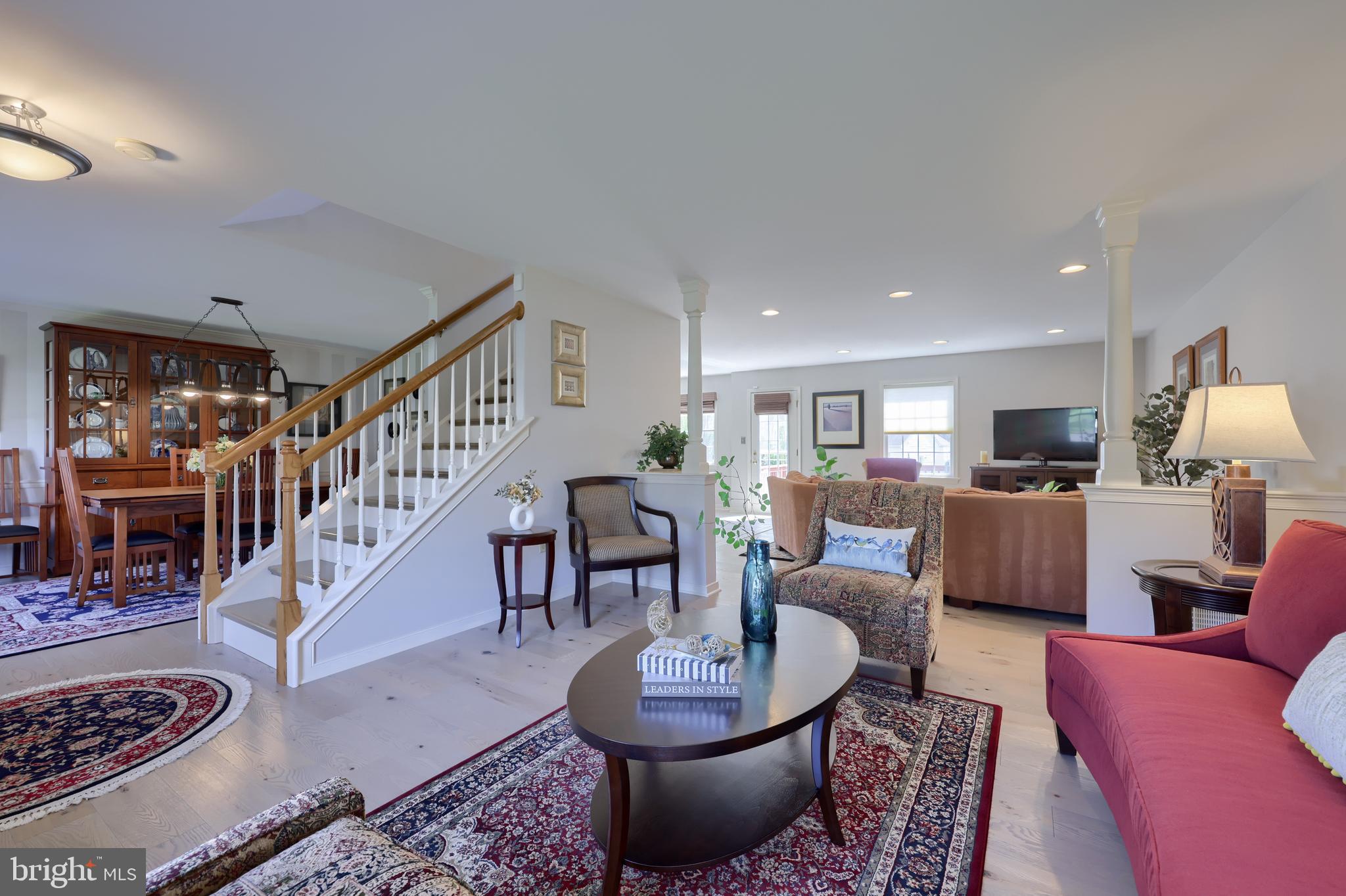 362 Squire Lane Lititz, PA 17543 - Photo 4 of 49 a living room with furniture a dining table and a floor to ceiling window