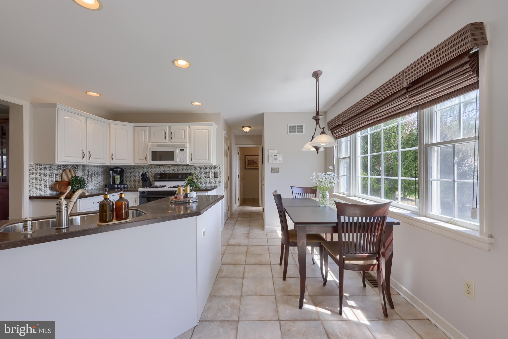 362 Squire Lane Lititz, PA 17543 - Photo 8 of 49 a kitchen with stainless steel appliances granite countertop sink microwave and wooden cabinets