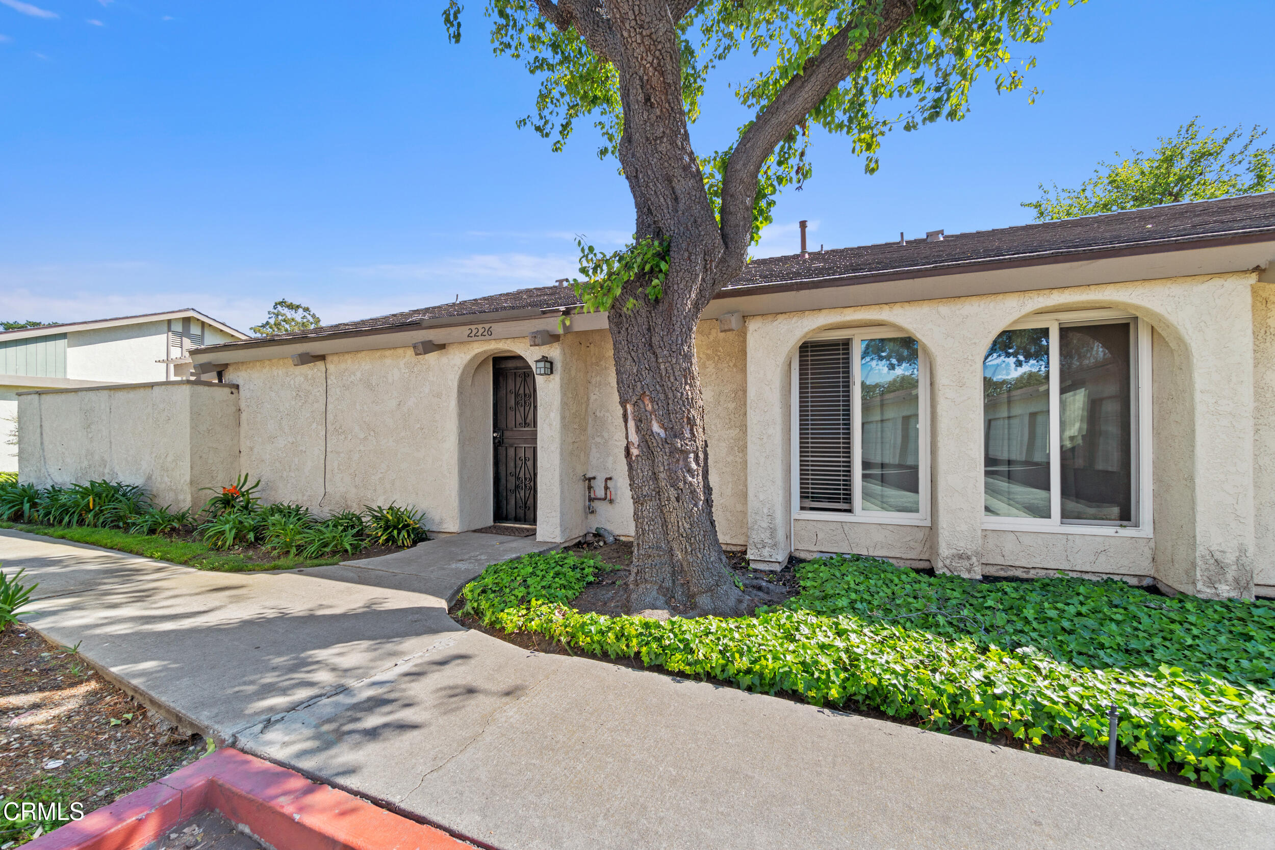 2226 North H Street Oxnard, CA 93036 - Photo 1 of 14 a front view of a house with garden