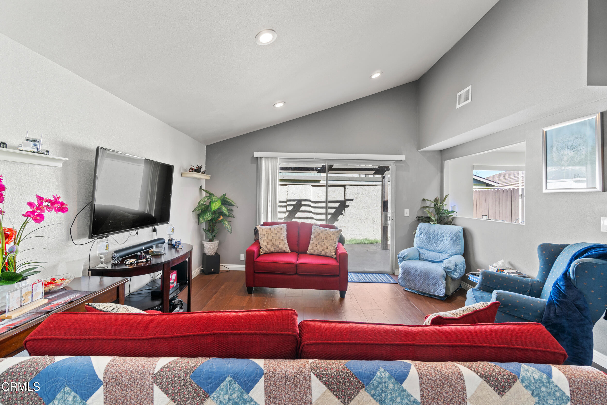 2226 North H Street Oxnard, CA 93036 - Photo 3 of 14 a bedroom with furniture and a flat screen tv