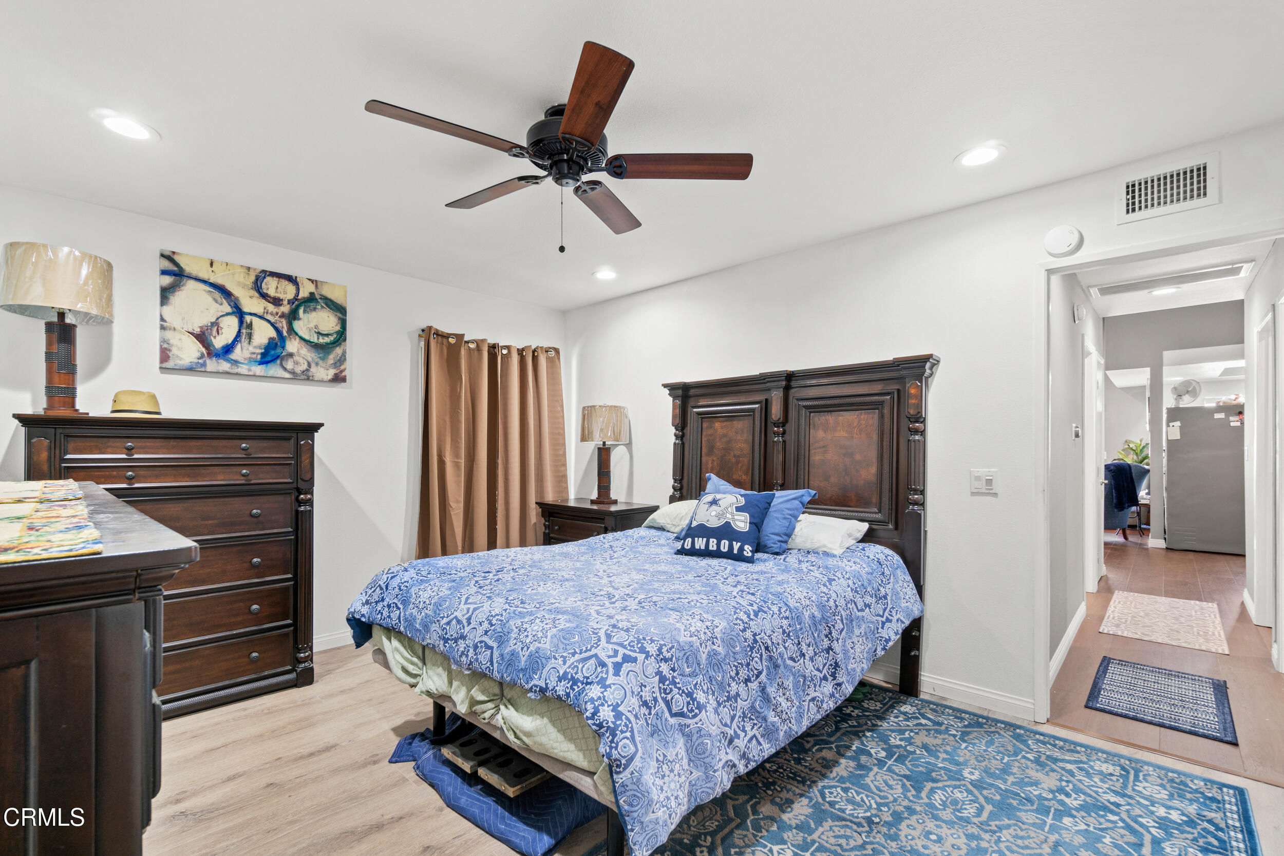 2226 North H Street Oxnard, CA 93036 - Photo 7 of 14 a bedroom with a bed and a dresser