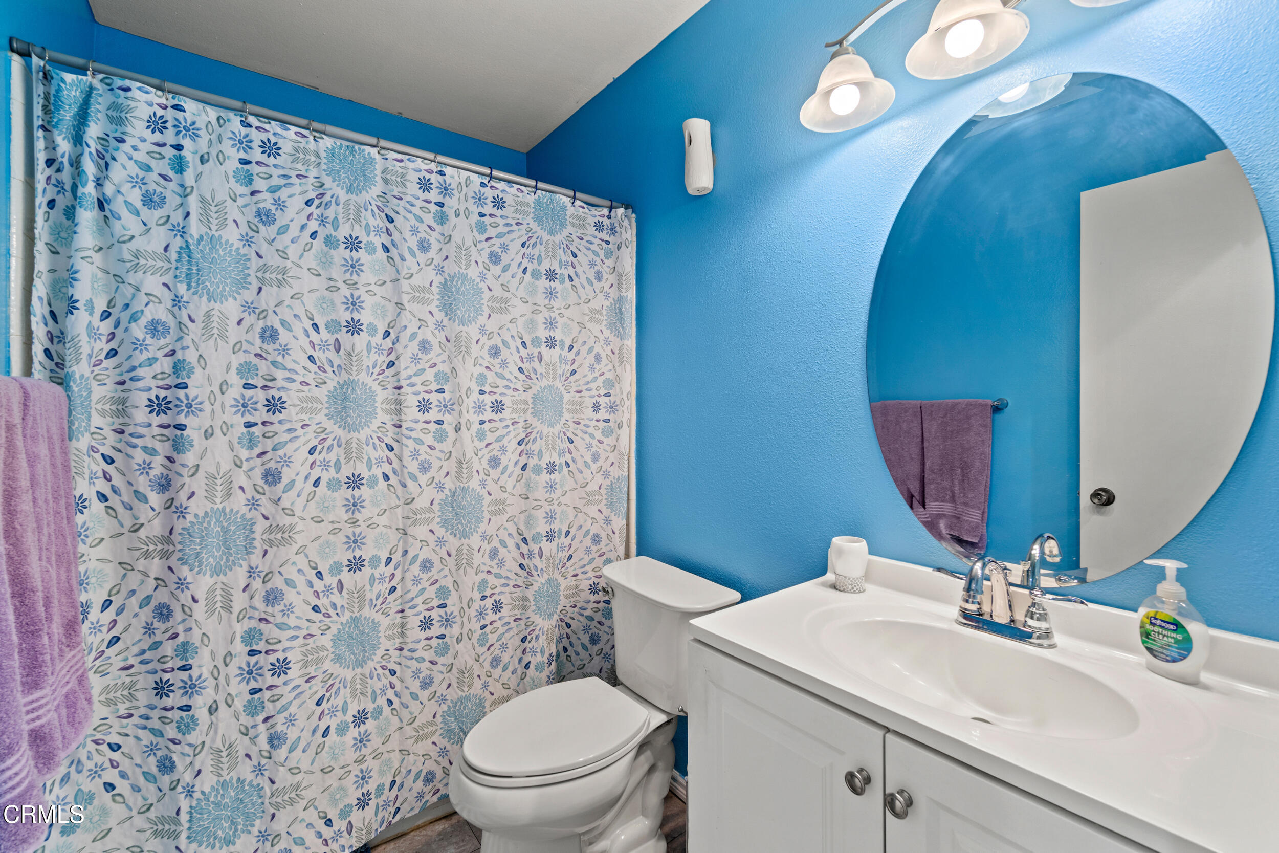 2226 North H Street Oxnard, CA 93036 - Photo 9 of 14 a bathroom with a sink a toilet and a mirror