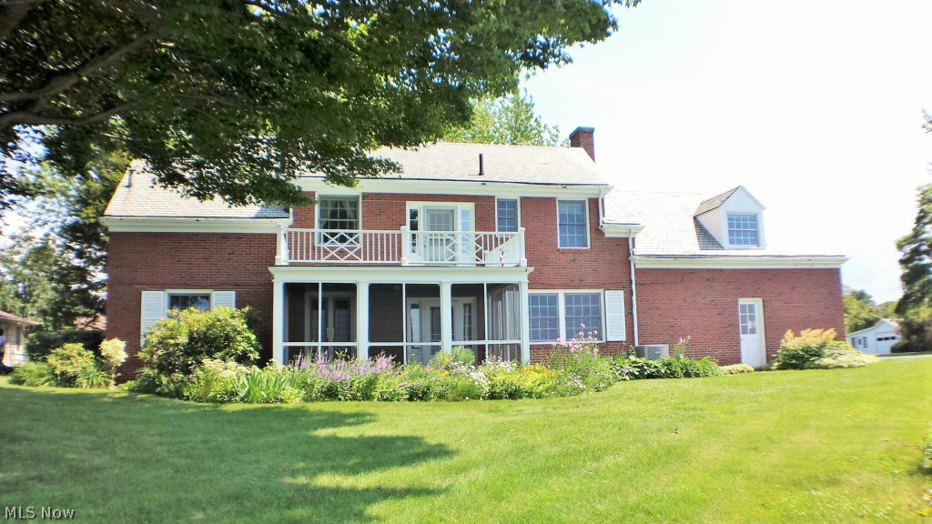 4567 Lake State Road Ashtabula, OH 44004 - Photo 2 of 25 Beautifully landscaped with a screened porch and observation deck