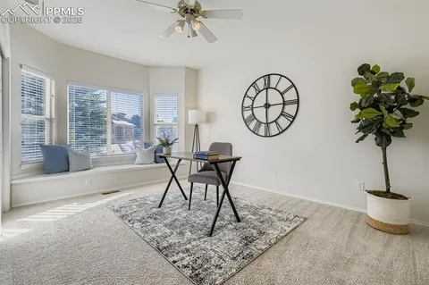 a view of a livingroom with furniture and a potted plant
