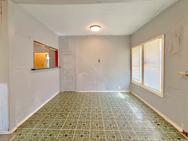 a view of an empty room and window