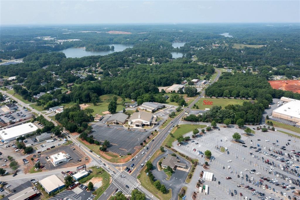 222 Brown Road Anderson, SC 29621 - Photo 5 of 12 An aerial perspective reveals a prime development opportunity nestled amidst a serene, wooded landscape.