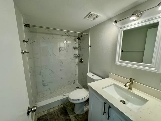 a room with a bed and lamp