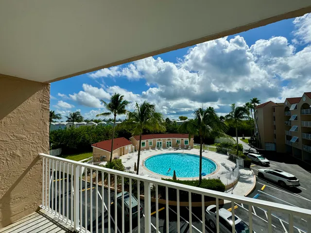 a view of balcony with furniture