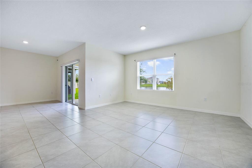 652 Greymount Street Davenport, FL 33837 - Photo 12 of 30 an empty room with windows