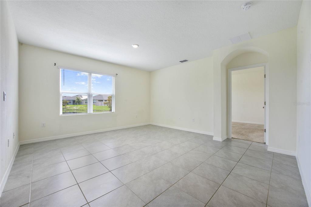 652 Greymount Street Davenport, FL 33837 - Photo 13 of 30 an empty room with windows