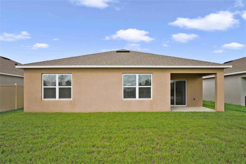652 Greymount Street Davenport, FL 33837 - Photo 14 of 30 a front view of a house with a garden