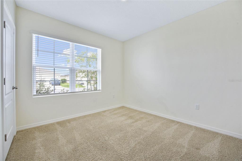 652 Greymount Street Davenport, FL 33837 - Photo 18 of 30 an empty room with a window