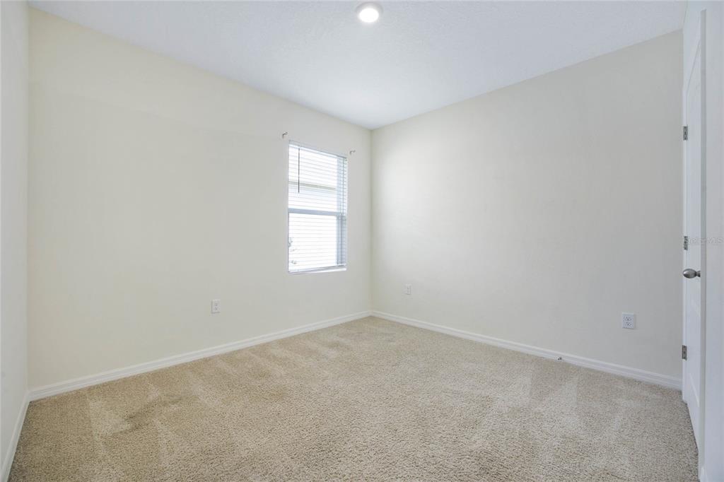652 Greymount Street Davenport, FL 33837 - Photo 20 of 30 an empty room with windows