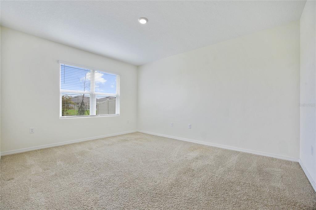652 Greymount Street Davenport, FL 33837 - Photo 25 of 30 an empty room with windows