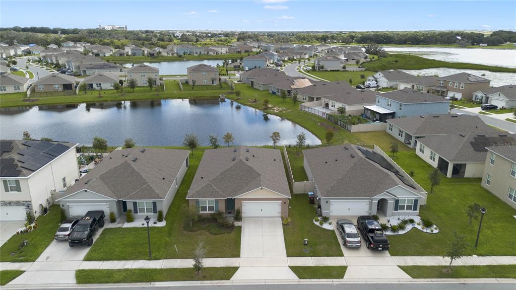 652 Greymount Street Davenport, FL 33837 - Photo 3 of 30 an aerial view of a house with outdoor space and lake view