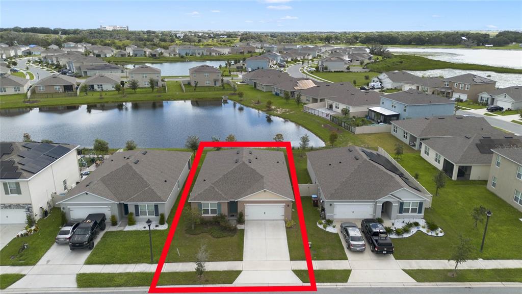 652 Greymount Street Davenport, FL 33837 - Photo 4 of 30 an aerial view of residential houses with outdoor space and lakeside