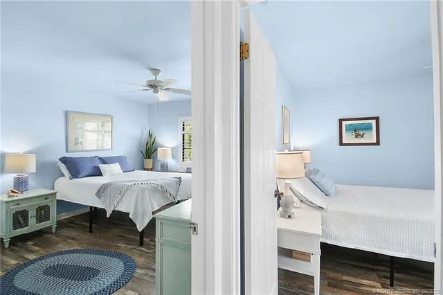 a bedroom with a bed and a table chair