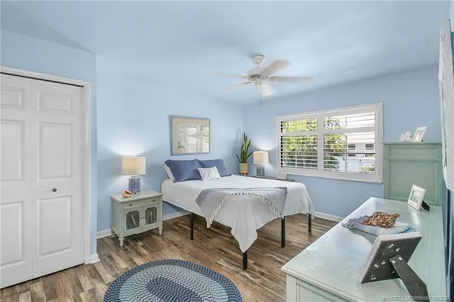 a bed room with a bed and a window