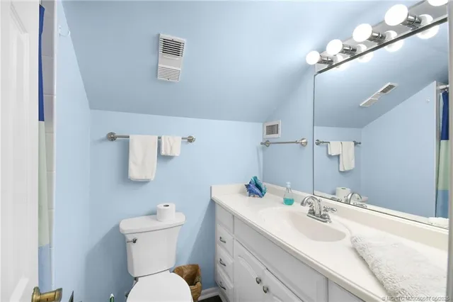 a balcony with table and chairs