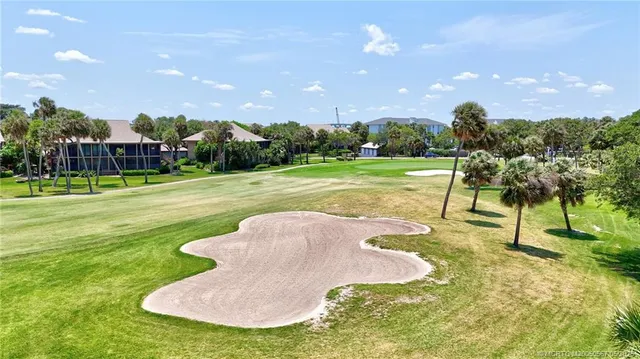 a view of a swimming pool and a yard