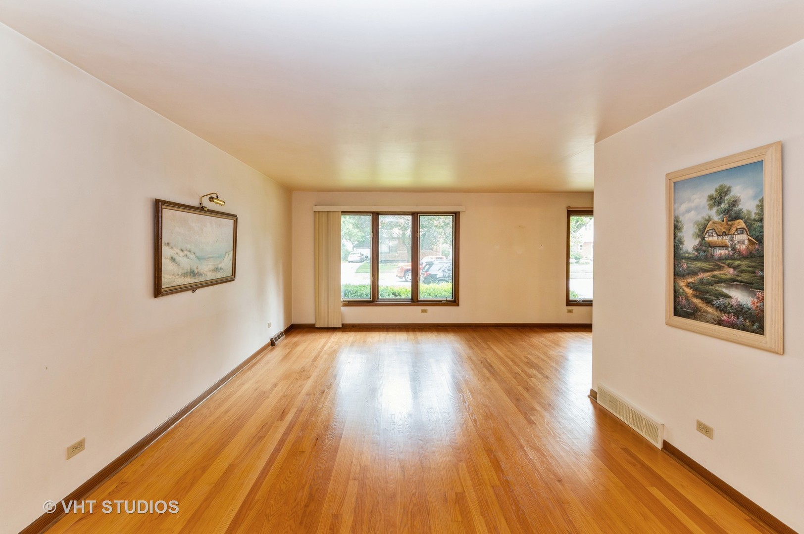 1232 Elder Road Homewood, IL 60430 - Photo 2 of 10 a view of an empty room with wooden floor and a window