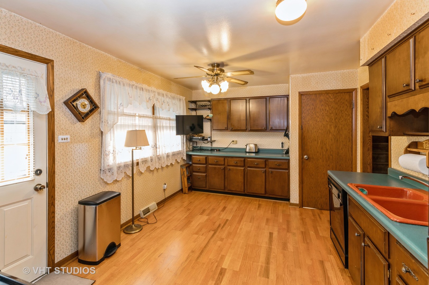 1232 Elder Road Homewood, IL 60430 - Photo 3 of 10 a kitchen with stainless steel appliances a refrigerator a stove a sink dishwasher a oven with a dining table and chairs with wooden floor
