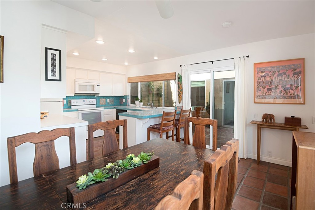 23761 Timor Bay Dana Point, CA 92629 - Photo 15 of 45 a living room with stainless steel appliances furniture a dining table and chairs