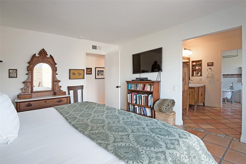23761 Timor Bay Dana Point, CA 92629 - Photo 29 of 45 a bedroom with furniture and a flat screen tv