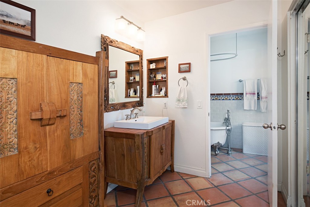 23761 Timor Bay Dana Point, CA 92629 - Photo 30 of 45 a bathroom with a sink a toilet and shower