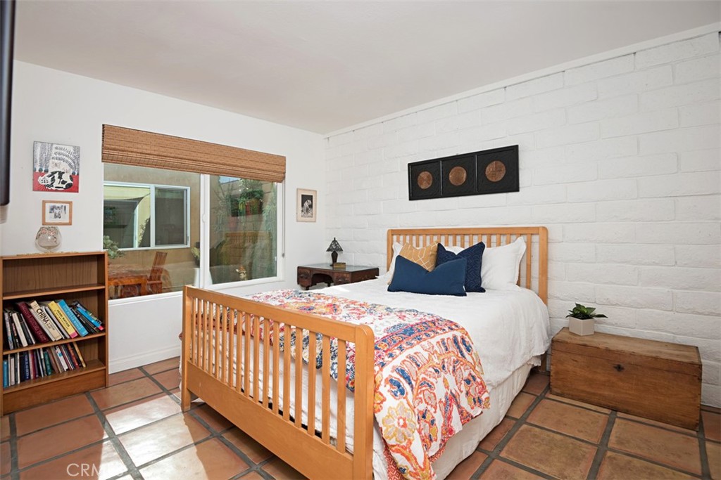 23761 Timor Bay Dana Point, CA 92629 - Photo 32 of 45 a bedroom with a bed and a book shelf