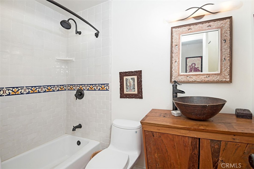 23761 Timor Bay Dana Point, CA 92629 - Photo 34 of 45 a bathroom with a granite countertop sink a toilet and a bathtub