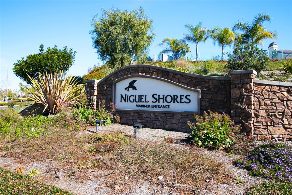 23761 Timor Bay Dana Point, CA 92629 - Photo 40 of 45 a sign that is sitting in front of flowers