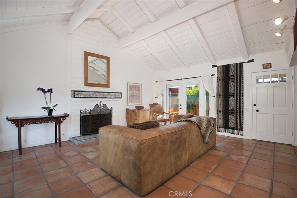 23761 Timor Bay Dana Point, CA 92629 - Photo 9 of 45 a living room with furniture a fireplace and a table
