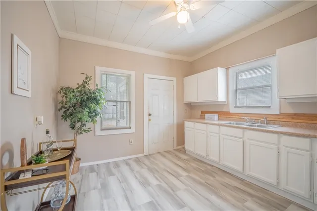 a spacious bathroom with a sink and a mirror