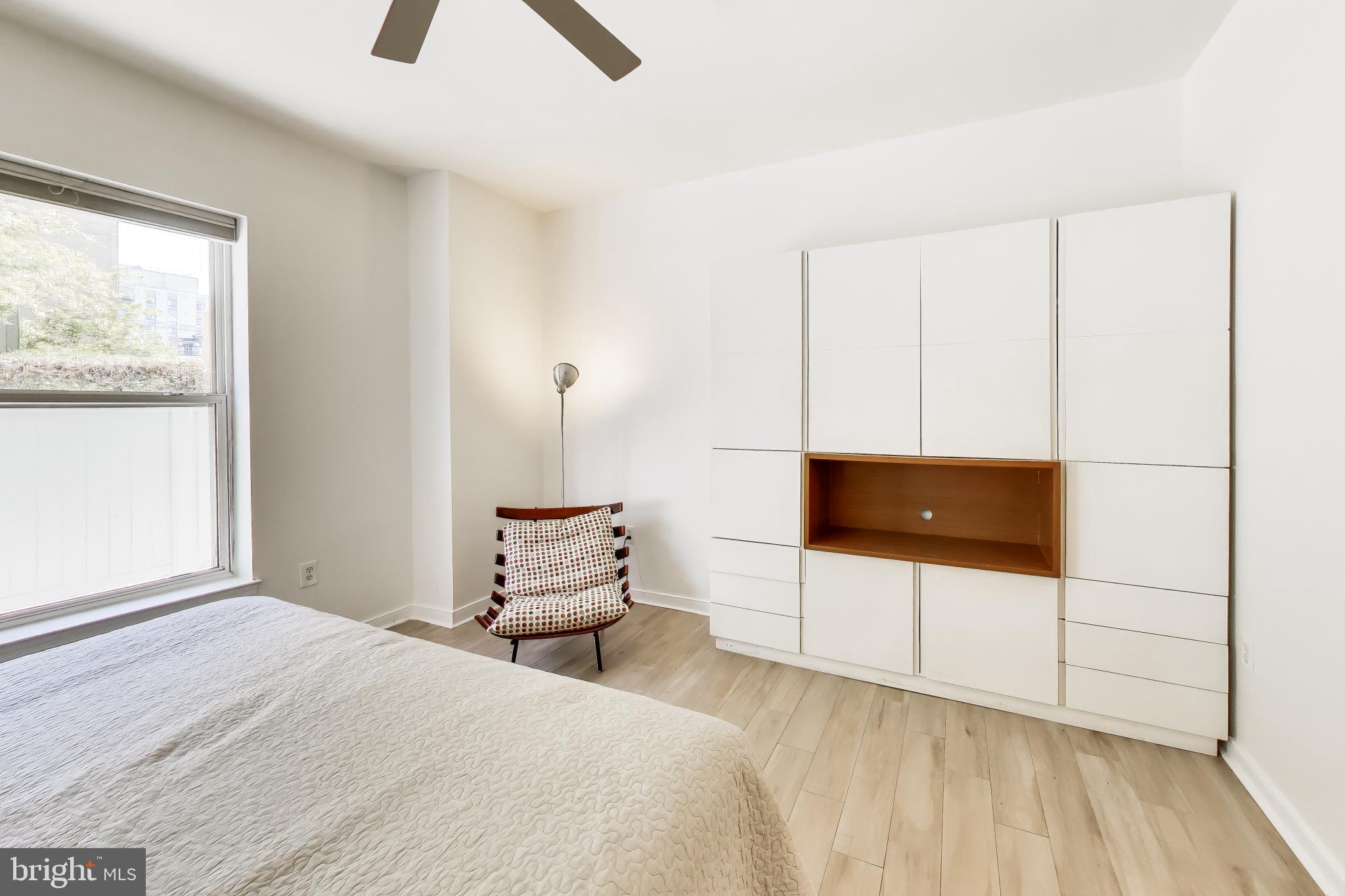 8045 Newell Street, Unit 118 Silver Spring, MD 20910 - Photo 21 of 39 a bedroom with a bed and a window