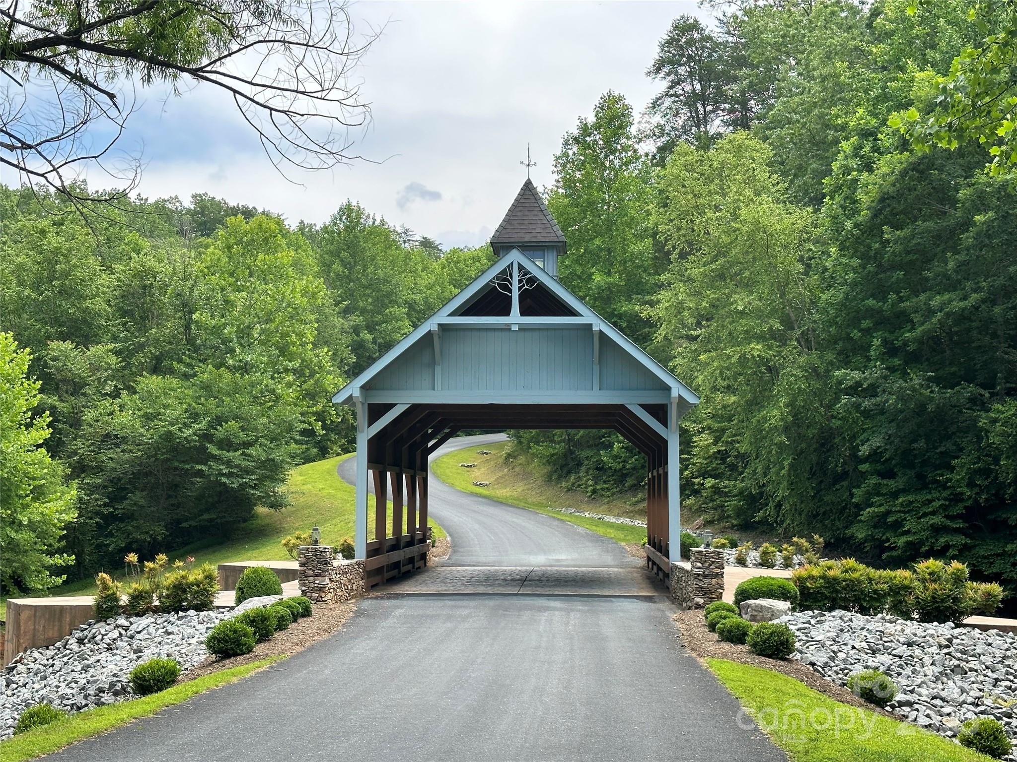 Lot 27 South Cove Rd Mill Spring Mill Spring, NC 28756 - Photo 17 of 20 a view of a small house with a street