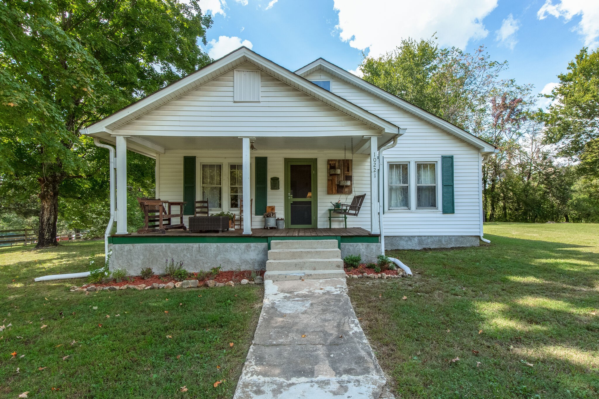 10221 Ed Lyell Road Lyles, TN 37098 - Photo 2 of 27 front view of a house with a yard