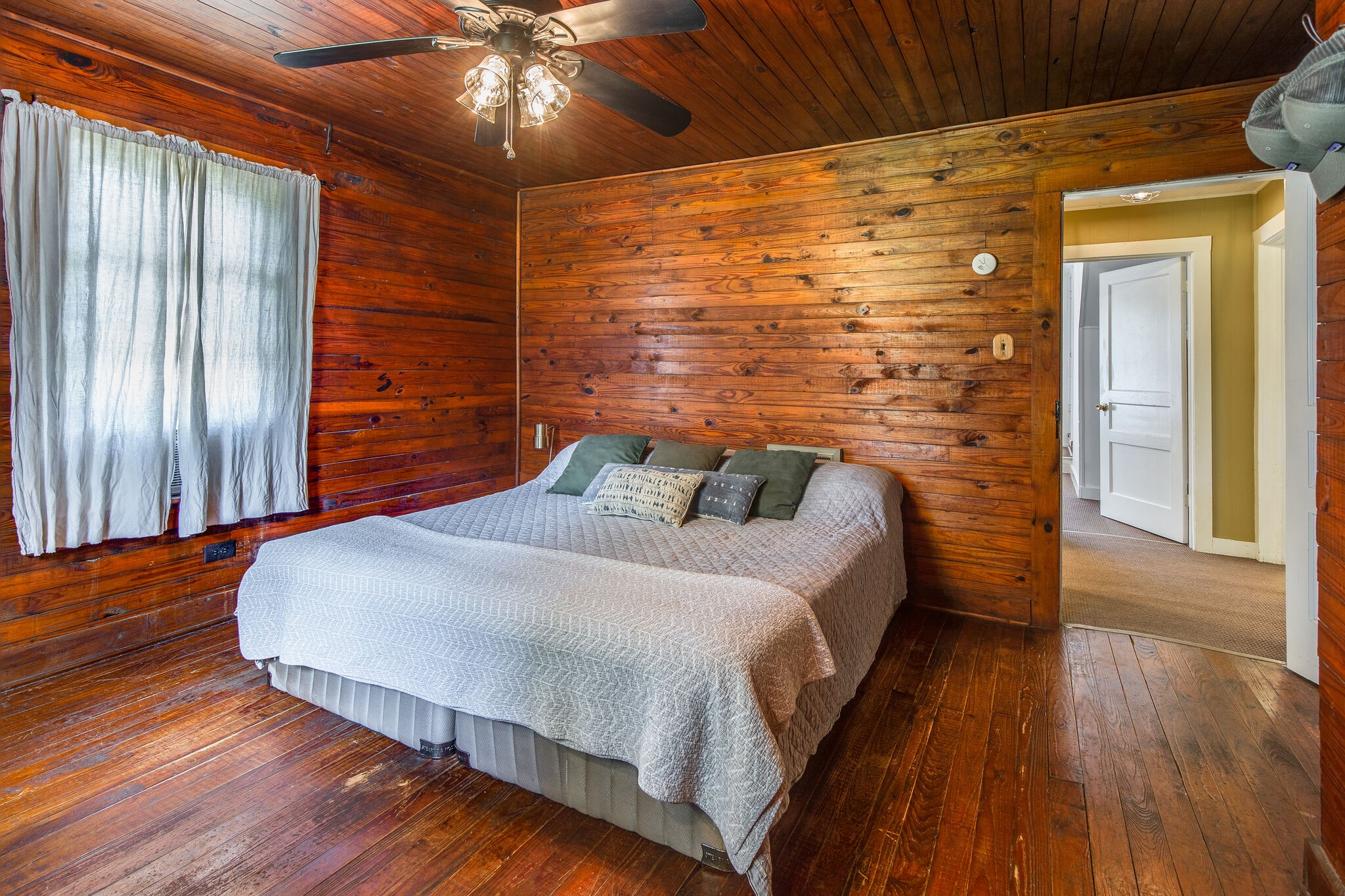 10221 Ed Lyell Road Lyles, TN 37098 - Photo 16 of 27 a spacious bedroom with a bed and wooden floor
