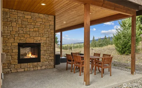 a view of a house with a yard outdoor space and balcony