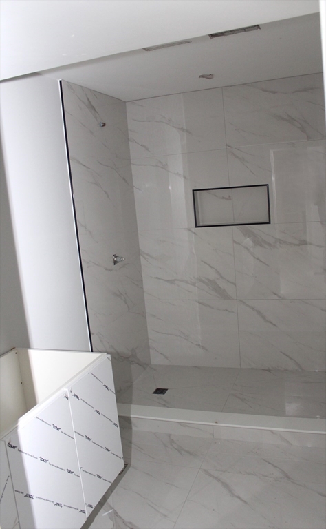 30 Mendon Street Upton, MA 01568 - Photo 10 of 26 a bathroom with a bathtub