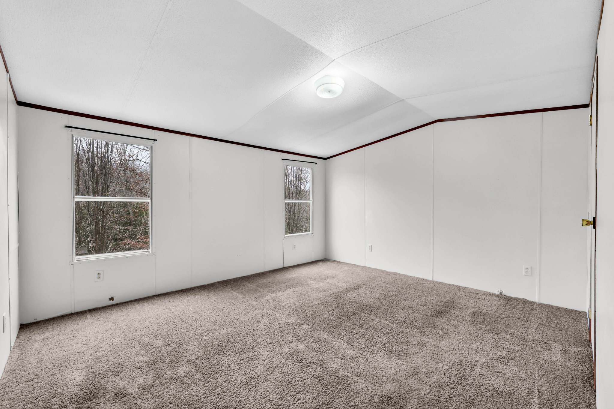 3845 Wickham Road Palmyra, TN 37142 - Photo 12 of 25 an empty room with a empty space and windows