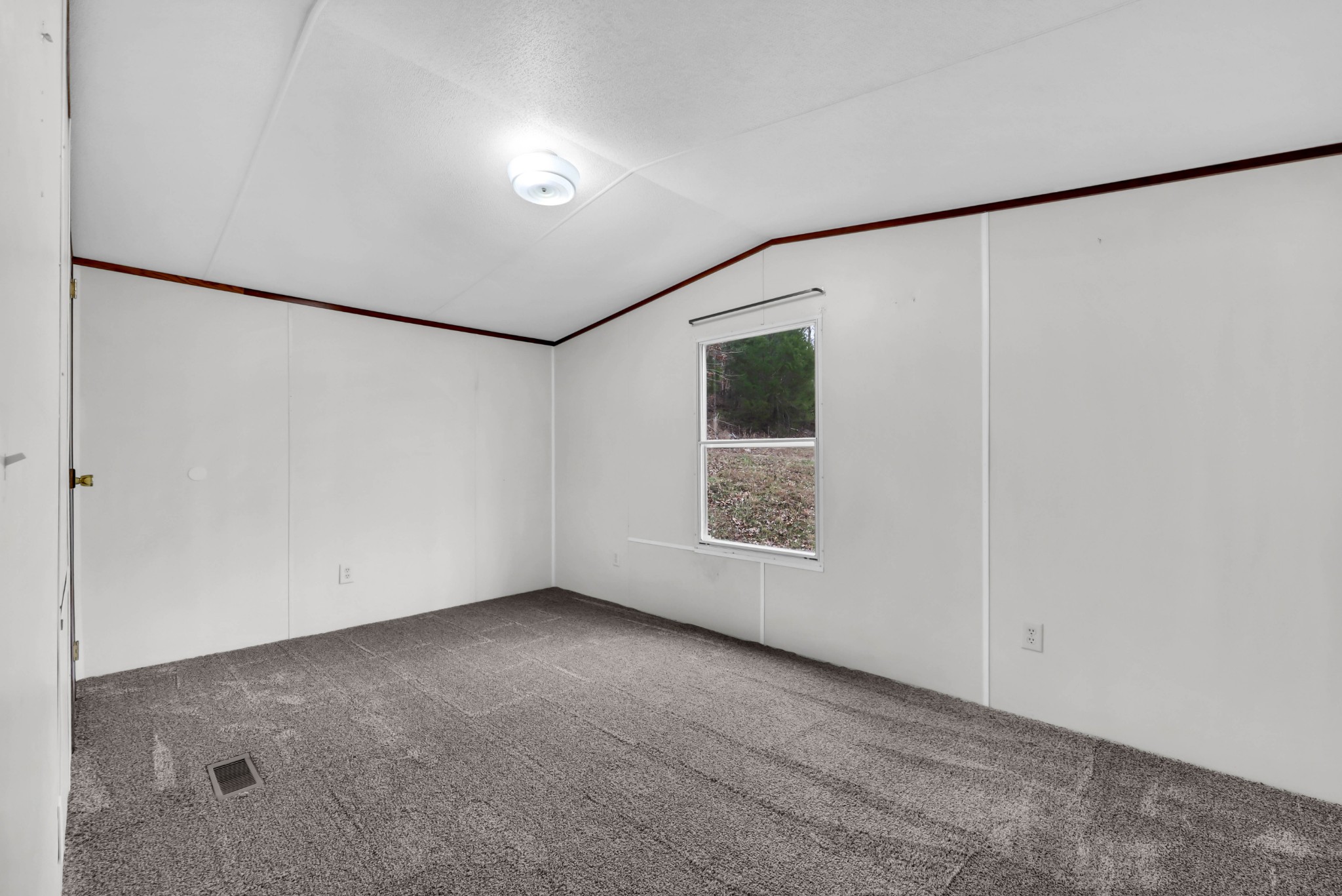 3845 Wickham Road Palmyra, TN 37142 - Photo 15 of 25 a view of an empty room with a window