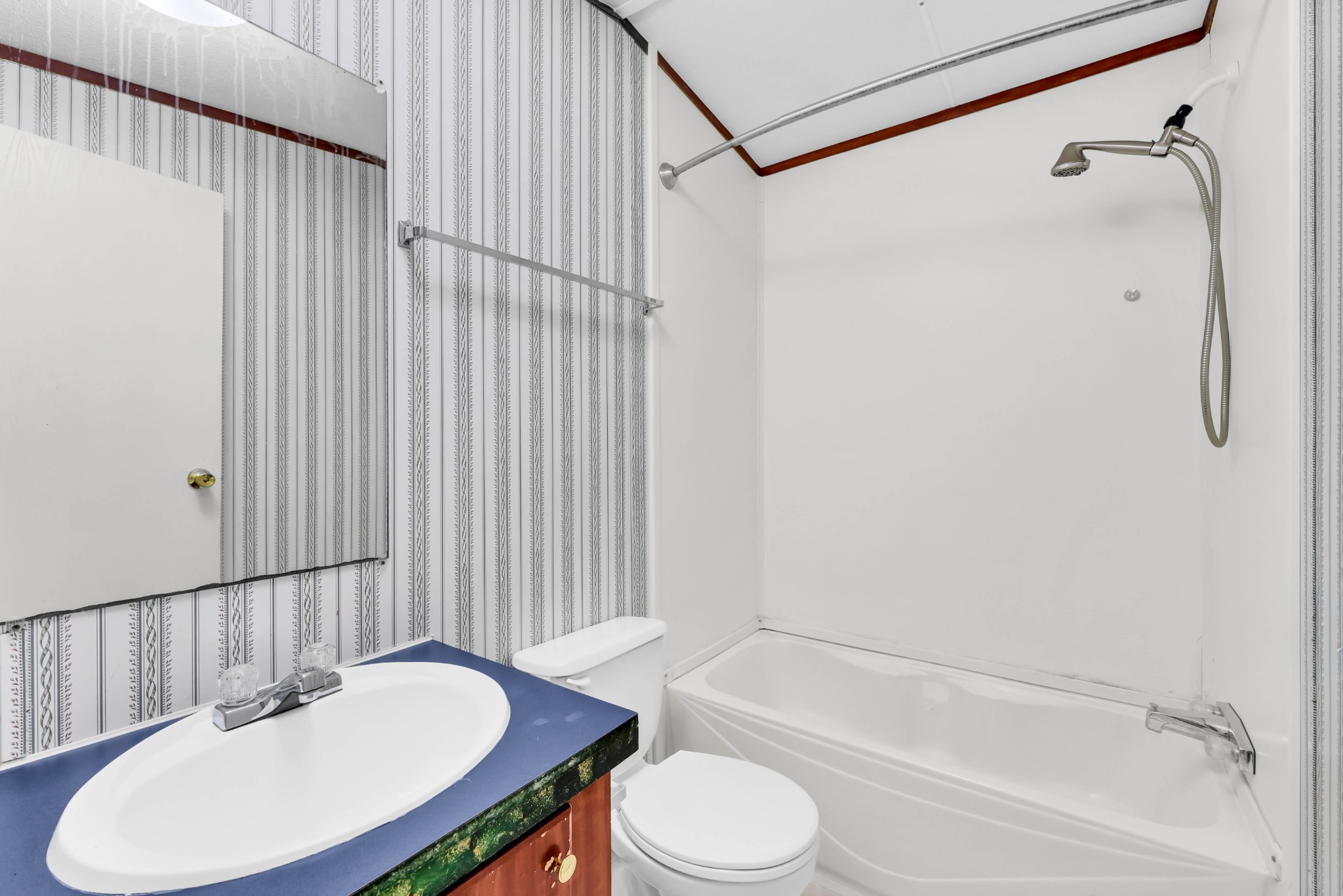 3845 Wickham Road Palmyra, TN 37142 - Photo 16 of 25 a bathroom with a sink toilet and shower